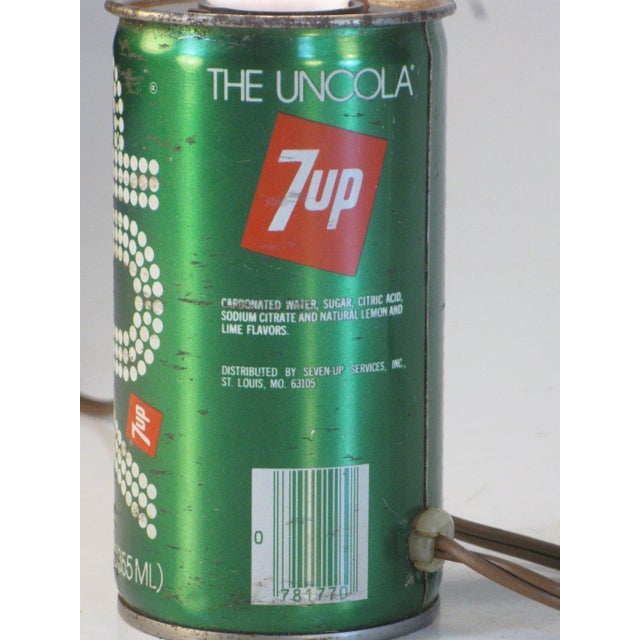 The Lamp 7 Up Can Electric Lighting Soda Hollywood Regency is a small, vintage accent lamp featuring a green light color...