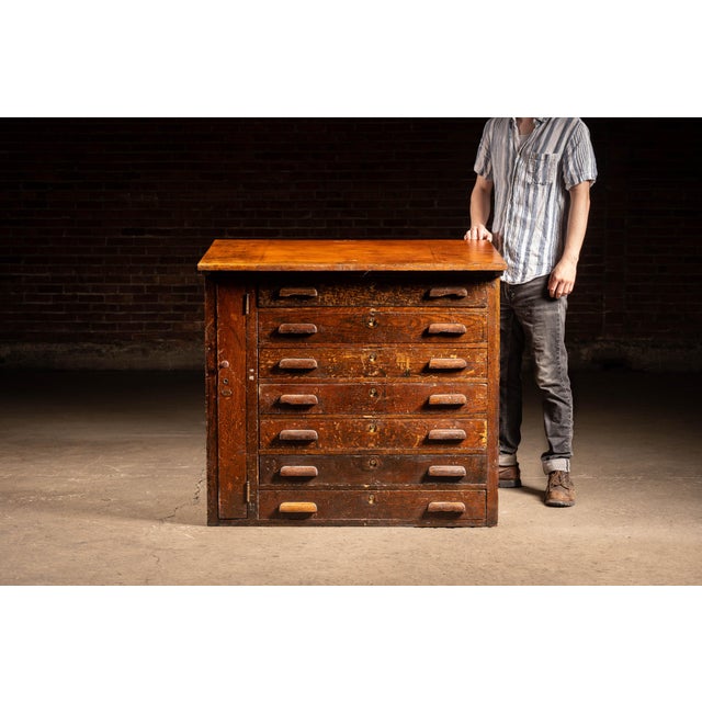 An impressive antique flat-file or document cabinet crafted from richly figured quarter-sawn oak. The substantial case...