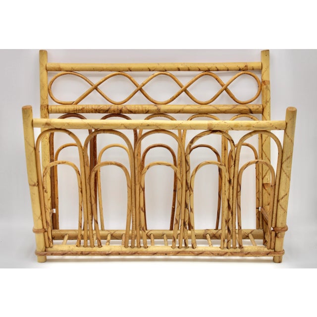 This is a vintage burnt bamboo magazine rack that has great coloration and design, circa 1960s. It is an eye catching, in...