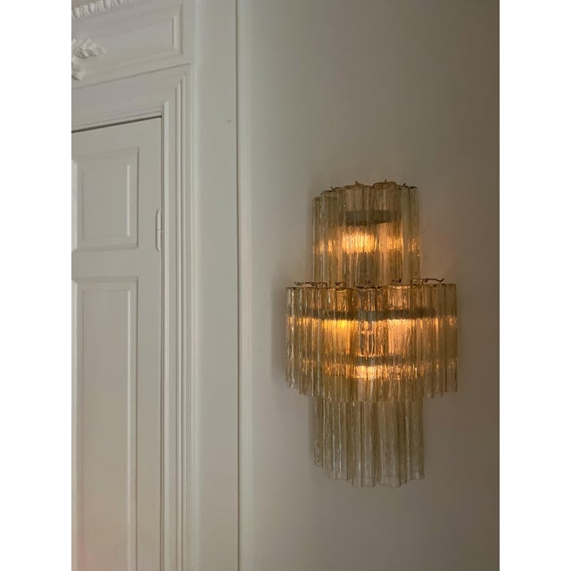 Set of 2 murano wall sconces, each lamp is consisting of eighteen tubular glass prisms in honey-amber tone with finishes...