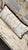 Vintage French Country Distressed Cream Painted Carved Wood Settee With Custom Toile Cushion For Sale - Image 10 of 15