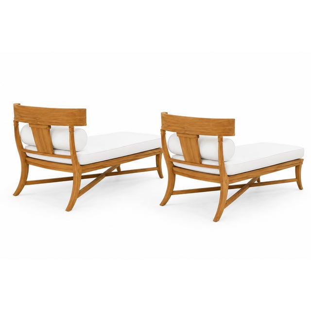 Modern Klismos teak outdoor chaises. . Chaises is in like condition. Newly upholstered. Solid and in beautiful condition....