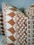 Custom pair of 22" pillows covered in Schumacher "Wentworth Embroidery" in rust and backed in a coordinating rust linen....