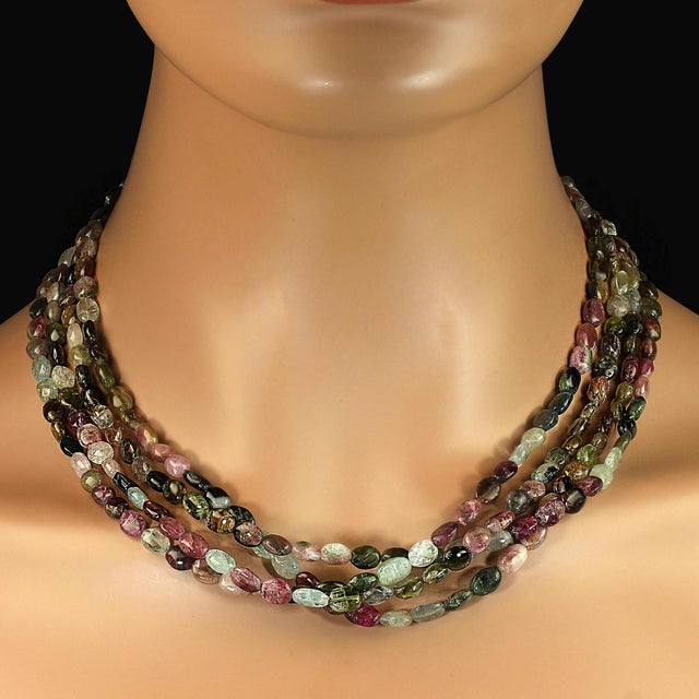 A 19‑inch four‑strand tourmaline nugget necklace becomes a true statement piece when described with the richness it...