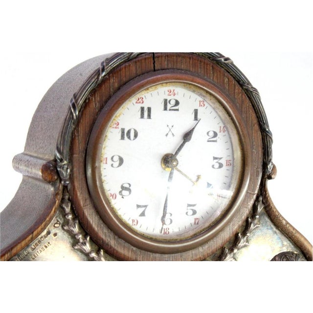Wooden Alarm Clock with Silver Applications, in Very Good conditions. Designed 1890 to 1919 This piece has an attribution...