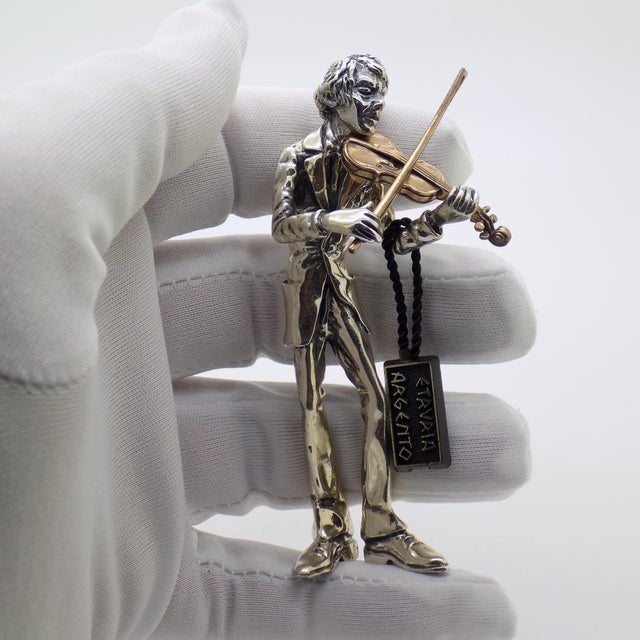 A large silver and brass violinist figurine, handcrafted in Italy during the 1970s/1980s by Etruria Gioielli. This...