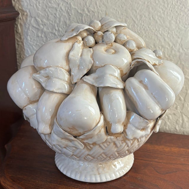 Detailed Italian large fruit porcelain bowl. Features a cornucopia of grapes, oranges, apples, bananas, etc. Attention to...