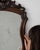A mirror whose dark carved wood frame with scroll crest, arched gives it real character at first glance. Originating in...