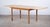 Striking rectangular brutalist dining table in oak, attributed to Henning Kjærnulf and produced in the 1960s. Featuring a...