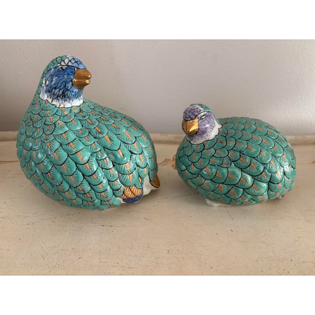 Vintage pair of hand painted quail statues. A a pair. Beautiful pieces for decor. Gold leaf, blues, orange and purple...