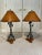 Set of stately and hard to find vintage table lamps by Maitland Smith. Solid bronze cross arrows with leather lamp shades.