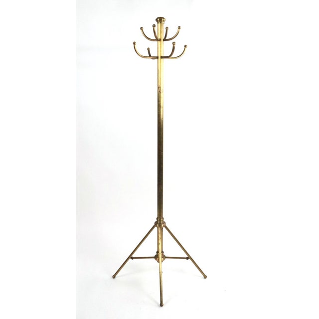 Steel coat tree rack in a Mid Century style popular in hotels and department stores. Splayed legs and eight hooks, four...