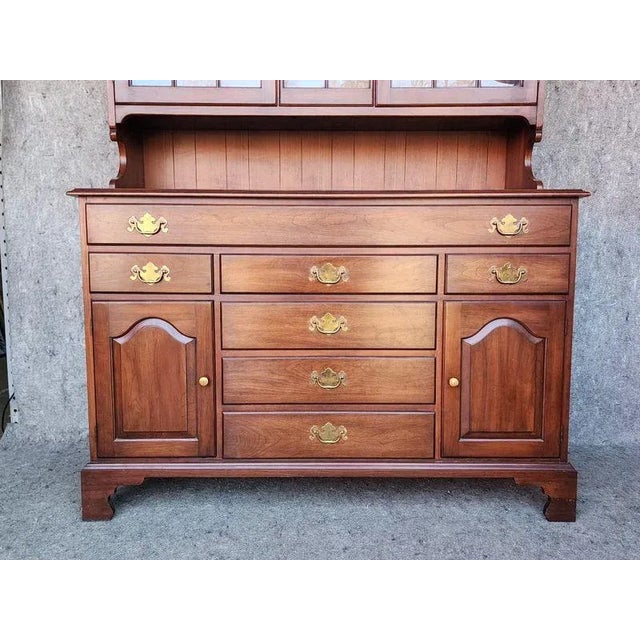 This Henkel Harris American Colonial Sideboard Buffet with Hutch Top is a beautiful piece of furniture made with cherry...