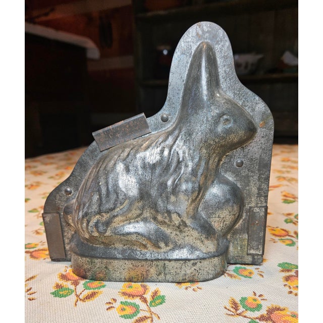 Small chocolate bunny with no indication of its maker or origin.