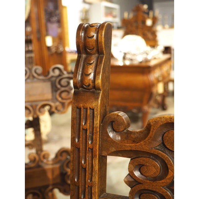 An exquisite set of 10 caned dining chairs, each frame was hand-carved from walnut wood in Italy, circa 1880. Each chair...