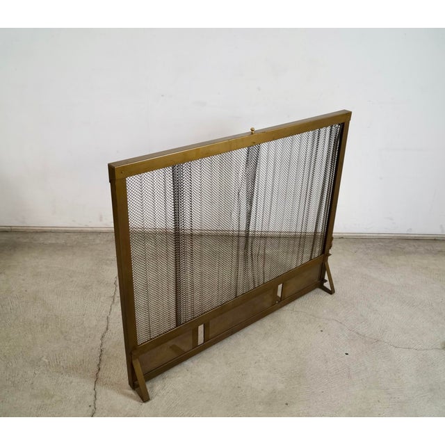 Vintage Hollywood Regency solid brass fireplace chimney screen for sale. It's really solid, and has a pull chain that...