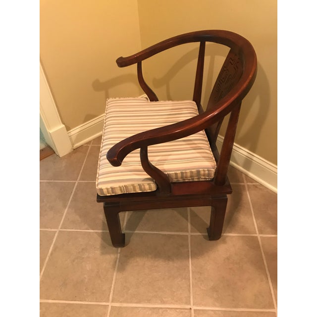 An iconic horseshoe back lounge chairs in the style of James Mont and made by the highly renowned Century Furniture...