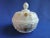 This gilded milk glass covered candy jar was made by the Westmoreland Glass Co. and it is pressed glass pressed in their...