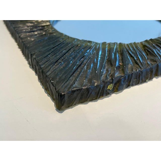 This very pretty and interesting little mirror is made of green resin. It is a French work. Circa 1970