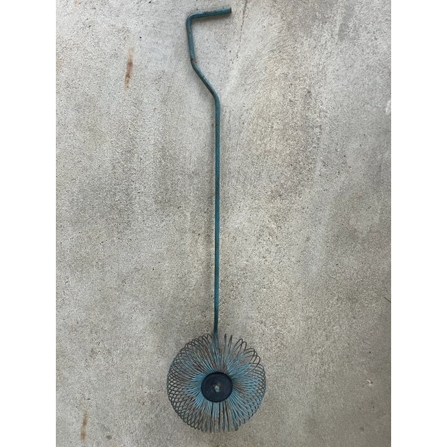 This piece displays like a Curtis Jere sculptural piece, but it was an implement used for picking up pecans. It’s a...