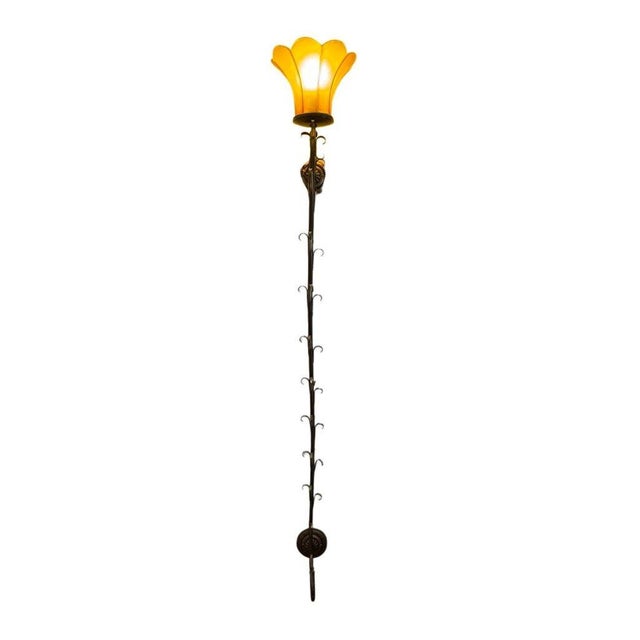 Elegant and refined, this vintage double long wall sconce features a beautifully elongated silhouette accented by a...