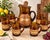 A wonderfully distinctive vintage sangria service featuring a large amber glass pitcher and six coordinating handled mugs....