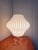 This authentic Nelson Pear Tripod Bubble Lamp is a mid-century modern accent table light designed by George Nelson for...