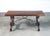 Solid walnut table with wrought-iron crossbars and lyre-shaped legs. Italy, 20th century. origin italy period 20th century...