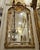 This breathtaking French Baroque style wall mirror features an exceptionally ornate gilded frame adorned with elaborate...