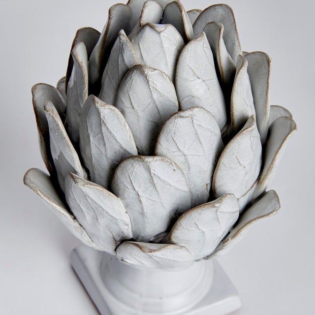 Enhance any space with this hand made ceramic artichoke accent. The reactive glaze and veining details speak to the...