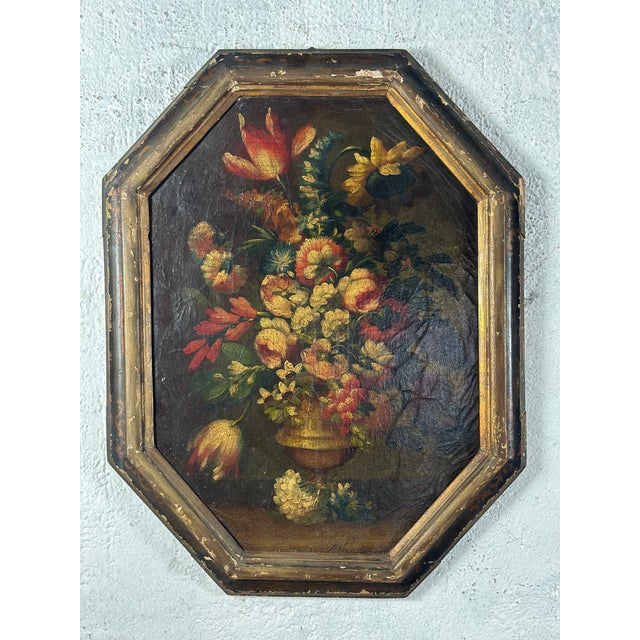 Beautiful antique oil on canvas depicting an abundant bouquet of garden flowers arranged in a classical urn. The...