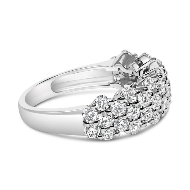 Discover the enchanting allure of this rhodium-plated .925 sterling silver ring, a masterpiece designed to sparkle with a...