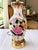 Elegant vintage table lamp featuring a beautifully decorated white porcelain body with colorful floral and botanical...