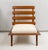Pair of sculptural mahogany lounge chairs upholstered in boucle fabric. Set of 2.