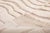Serenity, woven into every knot. This elegant hand-knotted Moroccan rug features a flowing ripple-like pattern in soft...