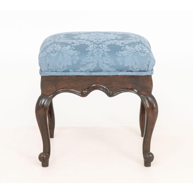 Victorian Style Blue Damask Upholstered Ottoman, with mahogany stained wood cabriole legs. 19" H x 19" W x 19" D....