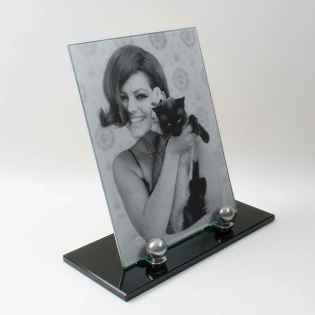 This lovely French Art Deco picture photo frame features a thick black opaline glass plinth complimented with two polished...