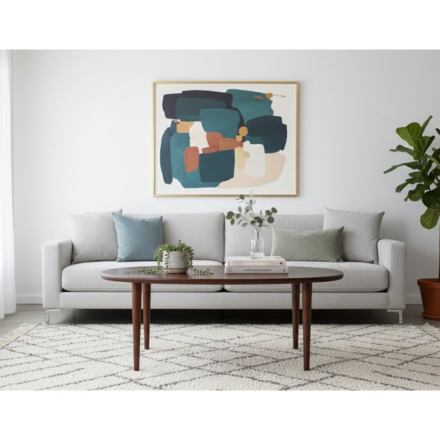 Beautiful oval coffee table crafted in richly grained rosewood, produced by Odense Møbelfabrik in the 1960s. The design is...