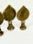 A trio of cast brass mirrors found in Nepal. These small objects mimicking flames would adorn shrines and temples to...