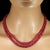 This exquisite two‑strand ruby necklace showcases a glowing array of graduated, smooth rondel‑shaped rubies ranging from...