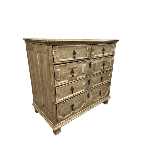 Handsome 18th century oak chest of drawers with a light bleached finish that highlights the natural wood grain. Features...