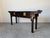 Elegant vintage Chinoiserie-style console table by Century Furniture, featuring a rich black lacquered ebonized finish and...