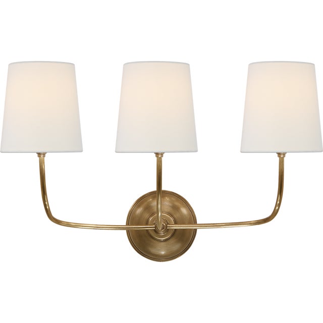 Thomas O'Brien for Visual Comfort Signature Vendome Triple Sconce in Hand-Rubbed Antique Brass with Linen Shades For Sale