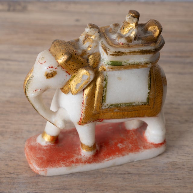 Polychrome painted and gilt alabaster elephant, India, Rajasthan, 19th century 4 ½ by 1 ¾ by 5 inches tall