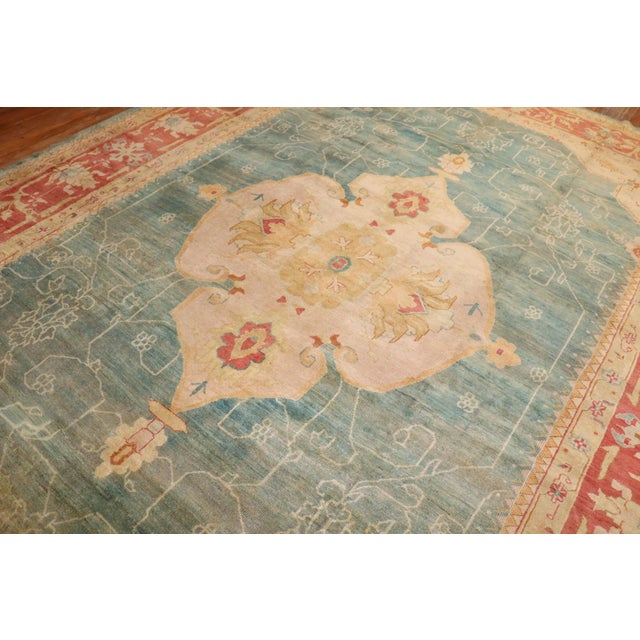 An extravagant connoisseur caliber early 20th-century antique Turkish oushak rug Measures: 10'9'' x 14'11''.