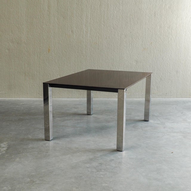 Striking Mid-Century Elegance: Saporiti Dining Table by Giovanni Offredi. The table exhibits a refined modernist...