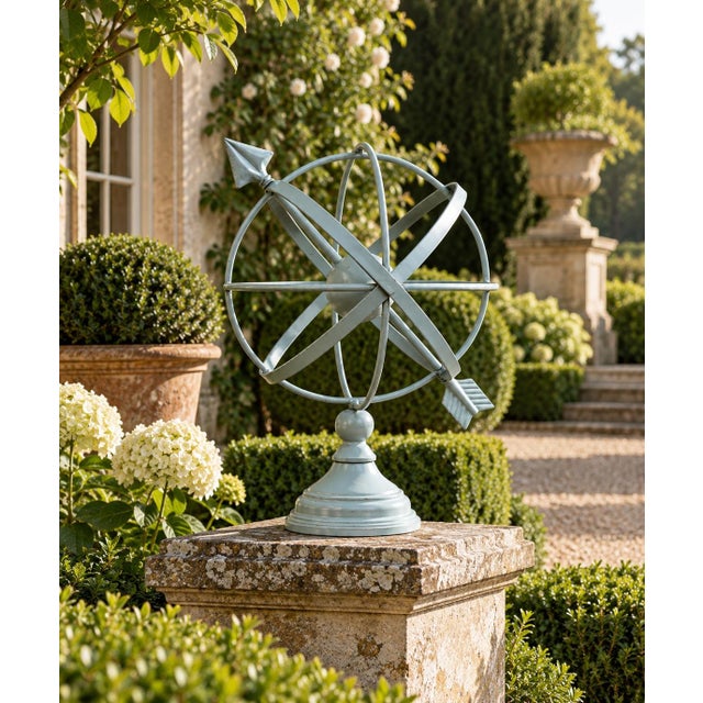 A beautifully crafted iron armillary sphere, evoking the timeless elegance of classical European gardens. Pieces like this...