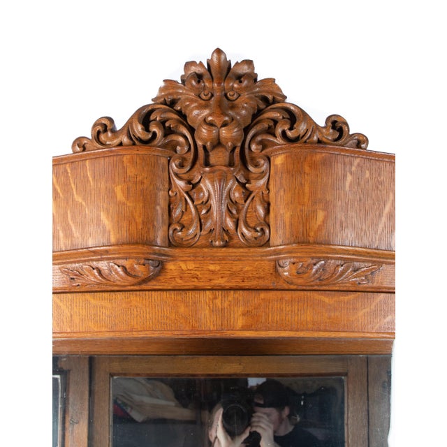Offering this stunning tiger maple Horner cabinet. Sitting atop 4 paw feet on casters it rises upward. On the front of the...