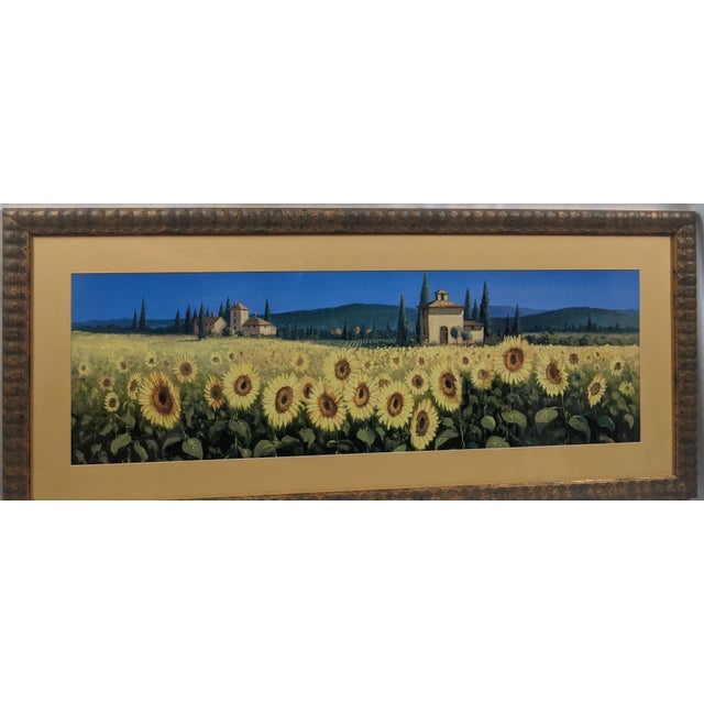 A beautiful panoramic landscape print capturing an expansive field of blooming sunflowers stretching toward classic Tuscan...