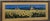 A beautiful panoramic landscape print capturing an expansive field of blooming sunflowers stretching toward classic Tuscan...